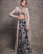 Gorgeous Indian Actress Rakul Preet in a Margot Floor Length Open Front Champagne Gold Long Jacket with a Plunging Neckline Bralette and Black Flared Skirt Pictures 01