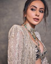 Gorgeous Indian Actress Rakul Preet in a Margot Floor Length Open Front Champagne Gold Long Jacket with a Plunging Neckline Bralette and Black Flared Skirt Pictures 02
