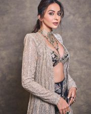 Gorgeous Indian Actress Rakul Preet in a Margot Floor Length Open Front Champagne Gold Long Jacket with a Plunging Neckline Bralette and Black Flared Skirt Pictures 03