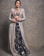Gorgeous Indian Actress Rakul Preet in a Margot Floor Length Open Front Champagne Gold Long Jacket with a Plunging Neckline Bralette and Black Flared Skirt Pictures 04