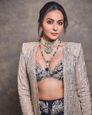 Gorgeous Indian Actress Rakul Preet in a Margot Floor Length Open Front Champagne Gold Long Jacket with a Plunging Neckline Bralette and Black Flared Skirt Pictures 05