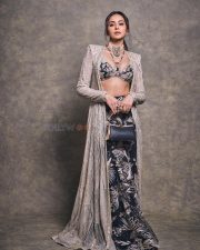 Gorgeous Indian Actress Rakul Preet in a Margot Floor Length Open Front Champagne Gold Long Jacket with a Plunging Neckline Bralette and Black Flared Skirt Pictures 07