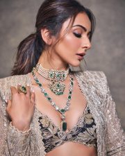 Gorgeous Indian Actress Rakul Preet in a Margot Floor Length Open Front Champagne Gold Long Jacket with a Plunging Neckline Bralette and Black Flared Skirt Pictures 09
