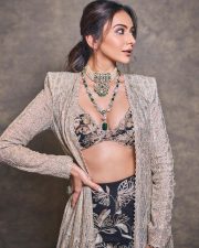 Gorgeous Indian Actress Rakul Preet in a Margot Floor Length Open Front Champagne Gold Long Jacket with a Plunging Neckline Bralette and Black Flared Skirt Pictures 10