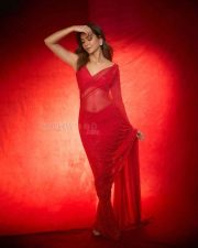 Gorgeous Kriti Kharbanda Navel in a Red Sparkly Saree with Sleeveless Blouse Pictures 01