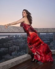 Gorgeous Tamannaah Bhatia in a Cavalli Red Halter Neck Rose Printed Dress Photos 02