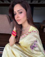 Graceful Actress Nushratt Bharucha in a Yellow Floral Embroidered Saree Photos 01