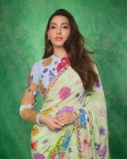 Graceful Nora Fatehi in a Floral Saree Pictures 01