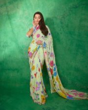 Graceful Nora Fatehi in a Floral Saree Pictures 04
