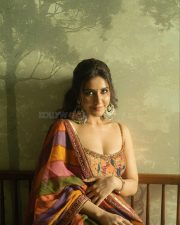 Graceful Raashi Khanna in a Floral Sleeveless Anarkali Dress with a Deep Neck Photos 03