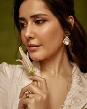 Graceful Raashi Khanna in an Ivory Linen Saree with Floral Embroidery with Puff Sleeve Blouse Photos 06