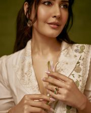 Graceful Raashi Khanna in an Ivory Linen Saree with Floral Embroidery with Puff Sleeve Blouse Photos 07