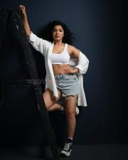 Heroine Rima Kalingal in a White Sports Bra and Denim Shorts Photoshoot Pictures 07