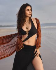 Hot Indian Actress Rakul Preet Singh in a Black Monokini with a Cutout Midriff with an Orange and Black Cover Up Pictures 04