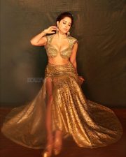Hot Nushrratt Bharuccha in a Busty Cleavage Golden Bra Top with a Thigh High Slit Skirt Pictures 07
