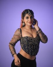 Hot Yashika Aannand in a Black Embroidered Netted Sleeve Top with a Black Skirt Photos 01