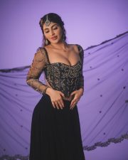 Hot Yashika Aannand in a Black Embroidered Netted Sleeve Top with a Black Skirt Photos 07