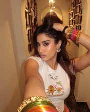 Hot and Sexy Janhvi Kapoor in a White Crop Top and Orange Mini Skirt Photos 02