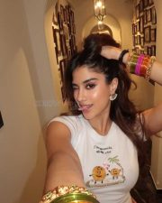 Hot and Sexy Janhvi Kapoor in a White Crop Top and Orange Mini Skirt Photos 04