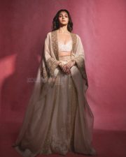 Indian Actress Alia Bhatt in a Custom Made Ivory and Gold Deep V Neck Blouse and Long Lehenga Skirt with a Sheer Cape Photos 07