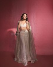 Indian Actress Alia Bhatt in a Custom Made Ivory and Gold Deep V Neck Blouse and Long Lehenga Skirt with a Sheer Cape Photos 08