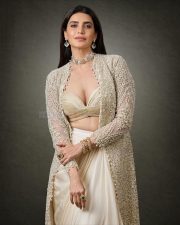 Irresistible Karishma Tanna in an Indo Western Outfit with Deep Bralette Blouse and Draped Skirt Photos 04
