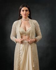 Irresistible Karishma Tanna in an Indo Western Outfit with Deep Bralette Blouse and Draped Skirt Photos 05