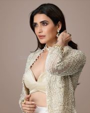 Irresistible Karishma Tanna in an Indo Western Outfit with Deep Bralette Blouse and Draped Skirt Photos 06