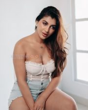 Irresistible Yashika Aannand Cleavage in a White Lace Strapless Bustier Corset Top And Blue Denim Cut Off Shorts Photos 07
