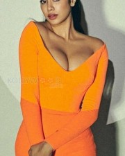Janhvi Kapoor Showing Big Cleavage in a Orange Dress Photos 01