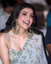 Kajal Aggarwal Laughing and Showing Cleavage in a Floral Saree 01