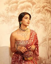 Kanchana 4 Actress Pooja Hegde in a Red and Gold Brocade Saree with a Matching Embroidered Corset Style Blouse Photos 09