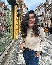 Karishma Tanna in a Light Beige Sweater and Blue Denim Photos 03