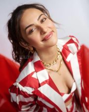 Khiladi 1080 Actress Rakul Preet Singh in a Red and White Striped Blazer with a Striped Crop Top Bandeau and Striped Mini Skirt Photos 02