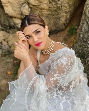 Kriti Sanon in a Transparent White Floral Saree Photos 01