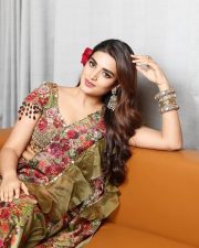Lovely Nidhhi Agerwal in a Floral Green and Red Lehenga Photos 01