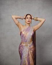 Luminous Actress Janhvi Kapoor in a Purple Gold Iridescent Sheer Saree Photos 01