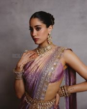 Luminous Actress Janhvi Kapoor in a Purple Gold Iridescent Sheer Saree Photos 02