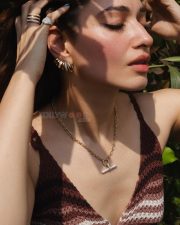 Luminous Actress Tamanna Bhatia in a Brown Striped Knit Top Photos 03