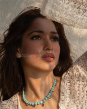 Luminous Actress Tamanna Bhatia in a White Lace Top Photos 03