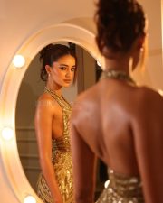Magnetic Ananya Panday in a Gold Sequined Halter Neck Deep V Neckline Gown Photos 09