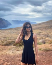 Malavika Mohanan in a Sexy Black Short Skirt Holiday Photos 03