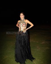 Mesmerizing Actress Ananya Panday in a Black Feathered Lehenga with Gold Butterfly Halter Photos 02