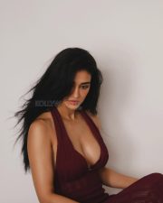 Mesmerizing Actress Disha Patani in a deep burgundy halter neck textured tank top photos 01