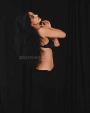 Mesmerizing Actress Disha Patani in a deep burgundy halter neck textured tank top photos 02