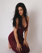 Mesmerizing Actress Disha Patani in a deep burgundy halter neck textured tank top photos 03