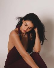 Mesmerizing Actress Disha Patani in a deep burgundy halter neck textured tank top photos 04