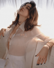 Mesmerizing Actress Janhvi Kapoor in a Sheer Ivory Open Shirt White Bralette Trousers Photos 01
