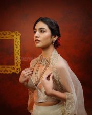 Mesmerizing Priya Prakash Varrier in a Sheer Cream Colored Traditional Low Neck Blouse with a Matching Lehenga Skirt Pictures Photos 01