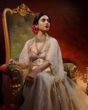 Mesmerizing Priya Prakash Varrier in a Sheer Cream Colored Traditional Low Neck Blouse with a Matching Lehenga Skirt Pictures Photos 03